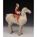 A CHINESE PAINTED POTTERY TOMB FIGURE of horse and rider, 31.5cm high x 29.5cm long, sold with '