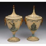 A PAIR OF REGENCY TOLEWARE PAINTED URNS AND COVERS, each with lion head ring handles and beehive and