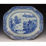 AN 18TH CENTURY CHINESE BLUE AND WHITE MEAT DISH, eight sided with oriental landscape decoration, 51