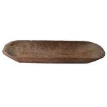 AN OLD TONGAN WOODEN FEASTING BOWL with rounded ends and simple plain supports, 151 x 54cm