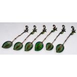 A SET OF SIX CONTINENTAL PLIQUÉ A JOUR COFFEE SPOONS of leaf form with scrolling handles (6)