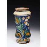 AN 18TH CENTURY ITALIAN MAIOLICA POTTERY ALBARELLO of waisted form decorated with blue, green and