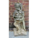 AN OLD WEATHERED GARDEN COMPOSITE STONE STATUE of a cherub holding a basket of flowers after the