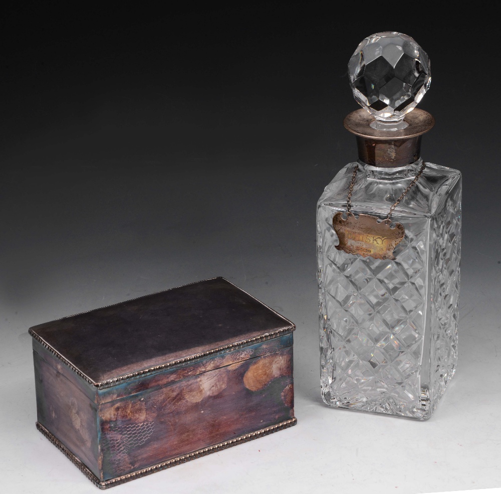 A HEAVY GLASS SPIRIT DECANTER AND STOPPER with silver collar and Whisky label, 26cm high; and a
