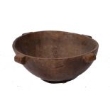 A Tongan circular wooden feasting bowl with simple lug handles 50cm