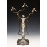 A CONTINENTAL ART NOUVEAU PEWTER THREE BRANCH CANDELABRA in the form of a girl with her arms