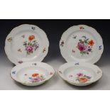 A PAIR OF LATE 19TH CENTURY MEISSEN PLATES with basket weave borders, painted with floral sprays,