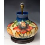 A MOORCROFT ANNA LILY PATTERN TABLE LAMP by Nicola Slaney, 21cm high overall