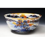 A CHINESE LATE 19TH CENTURY BOWL decorated in under glaze blue, voi red, green and gilt with