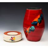 A 1960'S/70'S POOLE POTTERY VASE, the deep red glaze with abstract colour design, 22.5cm high; and a