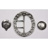 A LARGE SILVER SHOE BUCKLE, some damage, possibly Continental; a small silver clan badge, motto '