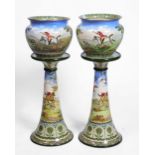 A PAIR OF ROYAL DOULTON SERIES WARE JARDINIERES AND STANDS decorated with continuous hunting scenes,