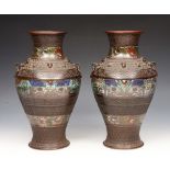 A PAIR OF CHINESE BRONZE AND CLOISONNÉ INLAID BALUSTER VASES with dragon head ring handles, 31cm