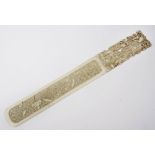 A CHINESE CARVED IVORY PAPER KNIFE, the handle with a mother and children, and the blade with