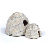 AN ESKIMO BONE MODEL of a double section igloo, 21cm deep x 13cm high; together with a male and