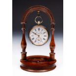 A LATE 19TH CENTURY TURNED ROSEWOOD POCKET WATCH STAND of arched form, 15.5cm high; together with