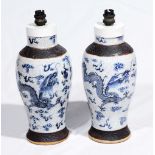 A PAIR OF CHINESE CRACKLE WARE BLUE AND WHITE TABLE LAMPS with shades, 33cm high (2)