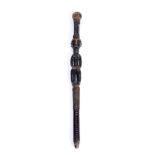 A CONGO OR FANG CARVED WOODEN STAFF HANDLE in the form of a female figure with leather strap work