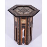A MIDDLE EASTERN MOTHER OF PEARL INLAID HEXAGONAL OCCASIONAL TABLE with mother of pearl and