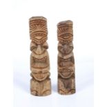 A PAIR OF TONGAN CARVED WOODEN TOTEMS of stylistic figure form, 27cm and 25cm high (2)