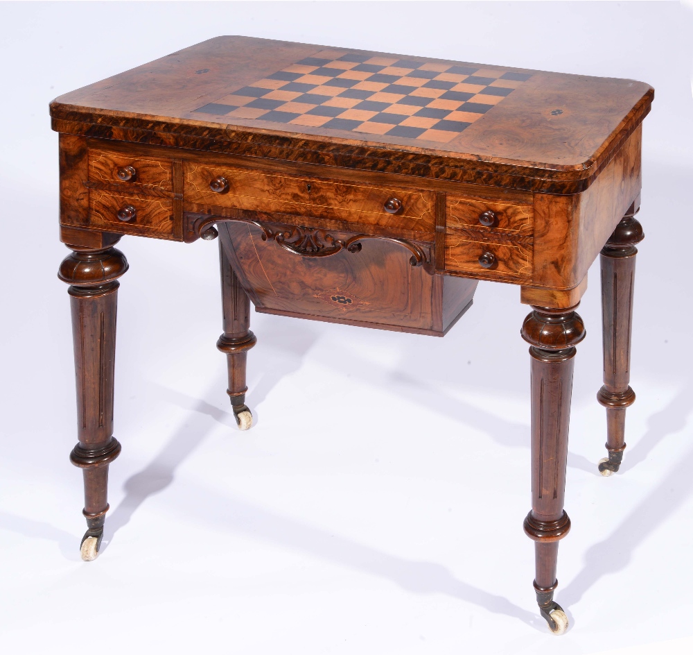 A VICTORIAN FIGURED WALNUT AND MARQUETRY INLAID GAMES TABLE, the fold over top with chess board