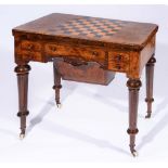 A VICTORIAN FIGURED WALNUT AND MARQUETRY INLAID GAMES TABLE, the fold over top with chess board