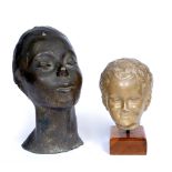 A CAST BRONZE HEAD of an African girl, indistinctly signed to the base, 32cm high, and a plaster