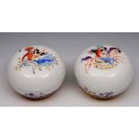 A PAIR OF MEISSEN ARABIAN NIGHTS CIRCULAR JARS AND COVERS, painted and gilt heightened with exotic