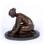 FERDINAND LEPCKE (1866-1909) A bronze study of a nude girl writing, signed on base and dated 1892