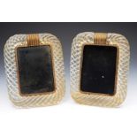 A PAIR OF 1930'S ART DECO GLASS PHOTOGRAPH FRAMES, of rounded rectangular wrythen form, with gilt