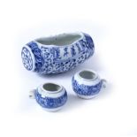 A GROUP OF THREE CHINESE BLUE AND WHITE PORCELAIN BIRD FEEDERS, one of barrel form, 8.5cm long, pair