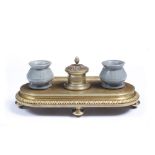 A 19TH CENTURY RUSSIAN GILT BRONZE INK STAND with hard stone bottles and cyrillic inscription