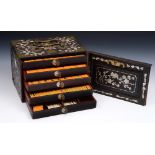 A MAH JONG SET, the cabinet fitted five drawers with mother of pearl inlay and brass mounted