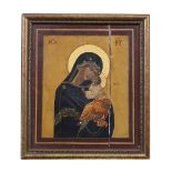 A 19TH CENTURY RUSSIAN PAINTED ICON portraying the Virgin Mary and the infant Christ, 24 x 20cm
