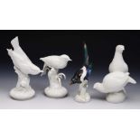 A MEISSEN FIGURE of a magpie, 21cm high; a Meissen white glazed figure of two quails; and two