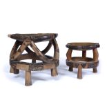 TWO TANZANIAN WOODEN STOOLS of two tier circular form with stylised decoration collected on a