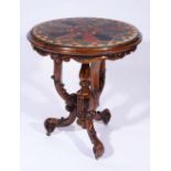 A VICTORIAN CARVED WALNUT CENTRE TABLE inset a specimen marble top with radiating veneers and