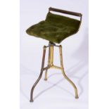 A REVOLVING BRASS MUSIC CHAIR stamped Fitter Birmingham with green velvet upholstered seat, 69cm