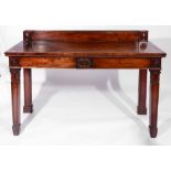 A GEORGE IV MAHOGANY RECTANGULAR SERVING TABLE fitted two frieze drawers with carved wreath ornament