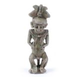 AN EGYPTIAN MINIATURE FAIENCE GLAZED PENDANT in the form of a male deity, 6cm high