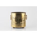 Manner of Mackay Hugh Baillie Scott Pot brass, decorated in relief with birds and a flowering tree