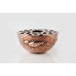 Newlyn School Flower holder hammered copper, decorated in relief with fish stamped 'NEWLYN' 7cm