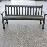 A slatted wooden garden bench,