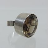 A 1970's Danish silver ring, with a large collet set smoky quartz, by N. E.