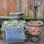 A reconstituted stone bird bath, 60cm tall, together with a collection of garden pots,