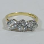An 18 carat gold three stone gem set ring