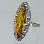 An 18 carat white gold citrine and diamond ring
