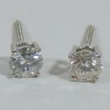 A pair of 14 carat white gold diamond stud earrings, with screw backs, approx. 0.