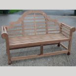 A teak Marlborough style garden bench,