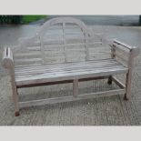 A teak Marlborough style garden bench,